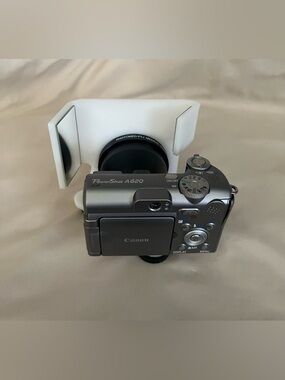 Canon PowerShot A620 digital camera with Photomed dental photography attachment